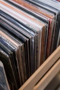 Row of vinyl records in their sleeves on a shelf